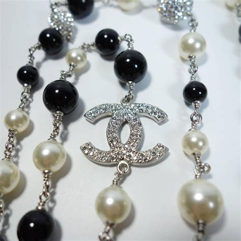 men chanel necklace|Chanel black and white necklace.